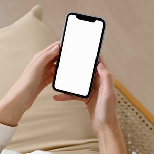 Woman holding smartphone with blank screen for mockup or design purposes, ideal for advertising.