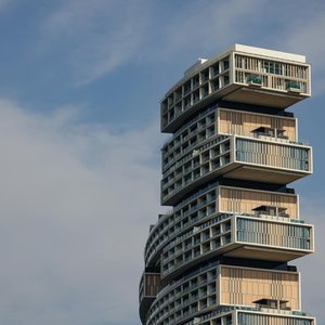 Discover the modern design of a unique high-rise building with stacked apartment modules.