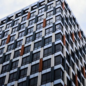 Low angle shot of a modern geometric office building in Melbourne, Australia, highlighting contemporary architecture.