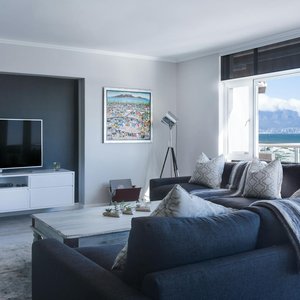 Stylish living room with a view of Table Mountain, blending modern design with natural beauty.