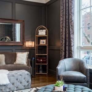 Luxurious living room showcasing contemporary design with plush seating and stylish decor.