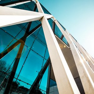 Modern architectural skyscraper with glass facade and steel beams in Kesklinna, Estonia.