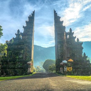 Stunning view of the Handara Gate in Bali with mountains and lush greenery.