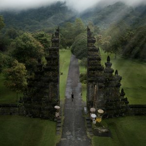 A stunning aerial view of the iconic Handara Gate amidst lush greenery in Bali, Indonesia.