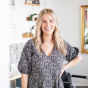 Female entrepreneur in a North Carolina salon, showcasing professional hairstyle and welcoming environment.