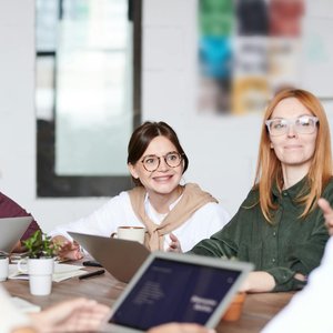A group of diverse professionals collaborating in a modern office setting.