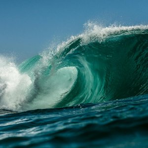 A stunning view of a powerful ocean wave crashing on the shores of Northern Chile.